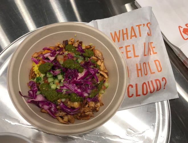A chicken shawarma rice bowl is ready to serve during a soft opening 2019 at Naf Naf Grill in Stanton.