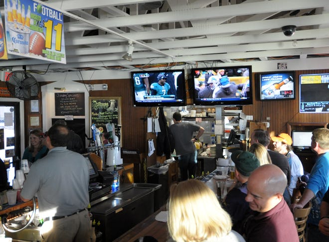 Fans gather at The Lighthouse in Dewey Beach to watch football in 2012.