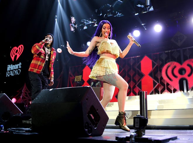 Cardi B (right) and Offset perform at 102.7 KIIS FM's Jingle Ball at The Forum on November 30 in Inglewood, California.