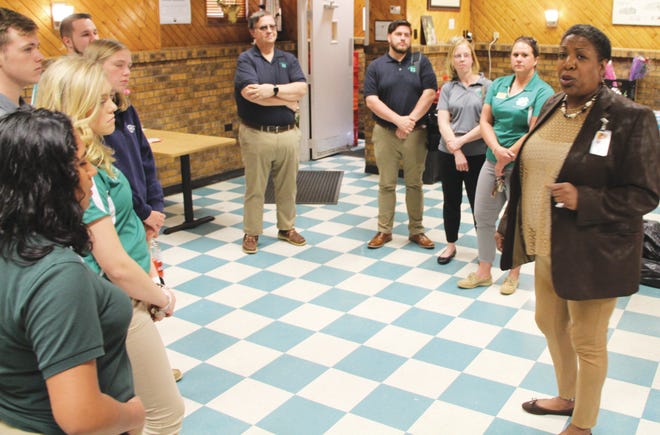 Members of Delaware 4-H are welcomed at the Ministry of Caring's Emmanuel Dining Room in Wilmington on Monday.
