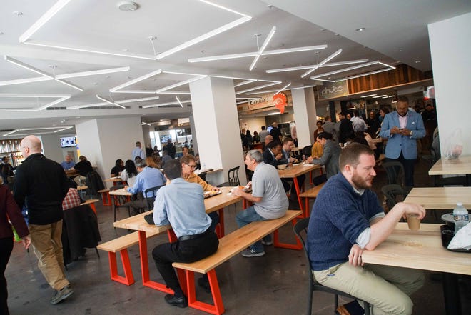 In this 2019 photo, patrons enjoy lunch at the Wilmington food hall known as DECO . It's on the first floor of the DuPont Building in downtown Wilmington at 10th and Orange streets.