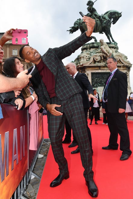 Will Smith obliges fans with selfies at the " Gemini Man " premiere on Sept. 25, 2019, in Budapest, Hungary.