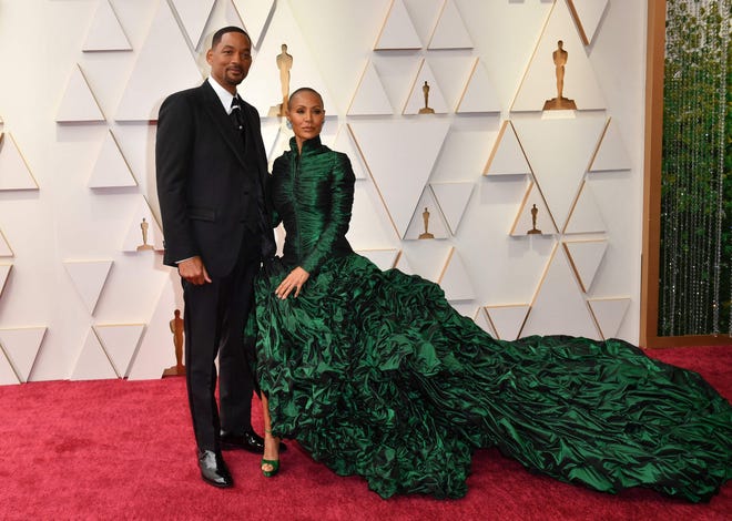 Will Smith, left, and Jada Pinkett Smith hit the red carpet at the 94th Oscars on March 27, 2022.