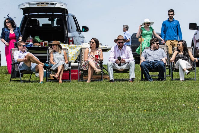 Guests watch the George A. ÒFrolicÓ Weymouth Antique Carriage Parade at the 45th annual Point-to-Point in Winterthur on Sunday, May 7, 2023. Proceeds from this year's event support environmental and landscape stewardship initiatives.