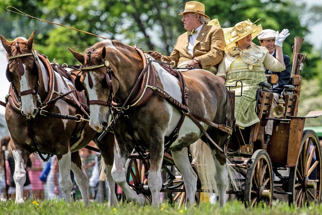 Guests watch the George A. “Frolic” Weymouth Antique Carriage Parade at the 45th annual Point-to-Point in Winterthur in Wilmington on Sunday, May 7, 2023. Proceeds from this year's event support environmental and landscape stewardship initiatives.
