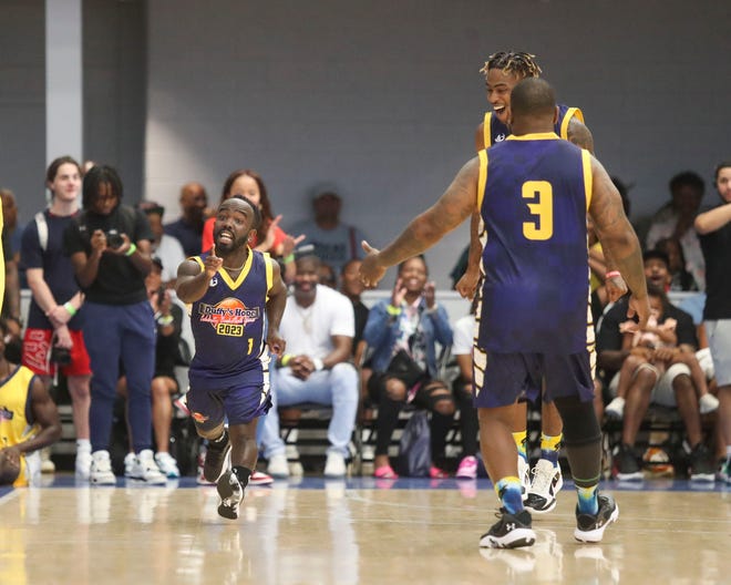 The Blue team's Mani Love (1) reacts after a basket during Duffy's Hope 19th Annual Celebrity Basketball Game at the Chase Fieldhouse in Wilmington, Saturday, August 5, 2023.