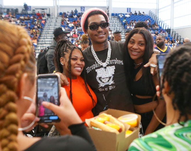 Demetrius "Lil Meech" Flenory Jr. poses with fans before Duffy's Hope 19th Annual Celebrity Basketball Game at the Chase Fieldhouse in Wilmington, Saturday, August 5, 2023.
