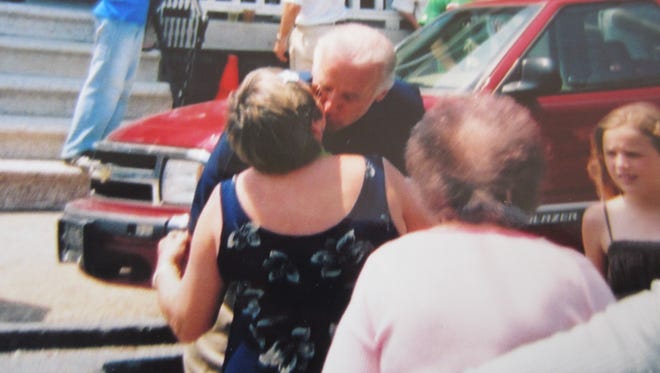 "Here is a photo taken of Joe giving me a kiss during the St. Anthony's Feast Procession in Little Italy."