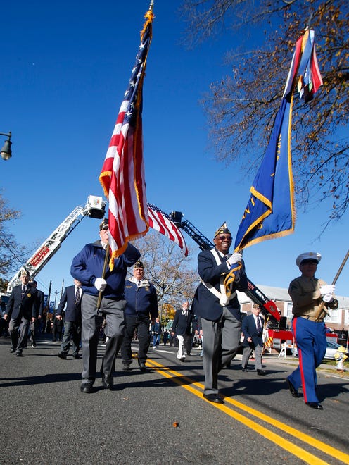 Veterans march along Washington Street during the Toms River Veterans Day parade Monday, November 14, 2016.