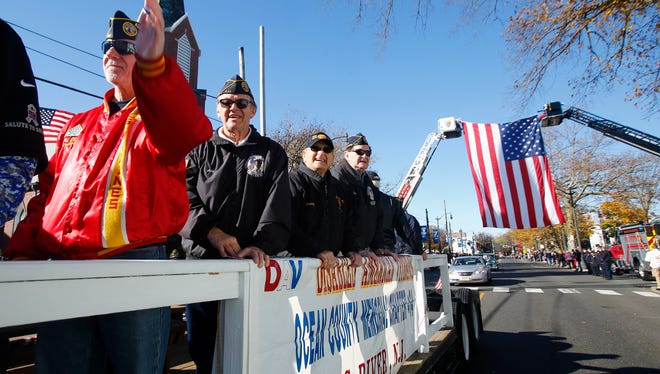 The Disabled American Veterans group rolls along Washington Street during the Toms River Veterans Day parade Monday, November 14, 2016.