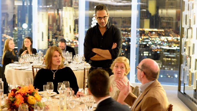 Chef John Tesar speaks with guests at A Mediterranean Odyssey Dinner hosted by Yotam Ottolenghi in New York City. Tesar will be a guest chef at this year's Celebrity Chefs' Brunch in Wilmington.