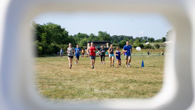 Participants approaching to their next obstacle course at The Great Inflatable Race in Shrewsbury, Pa. on Saturday, July 14, 2018. The race is almost one kilometer.