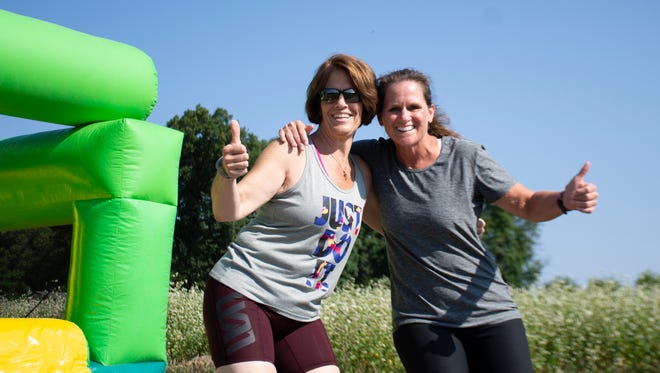 Michele D. from Mechanicsburg  and Nancy I. from York pose for a picture at The Great Inflatable Race in Shrewsbury,Pa. on Saturday, July 14, 2018.