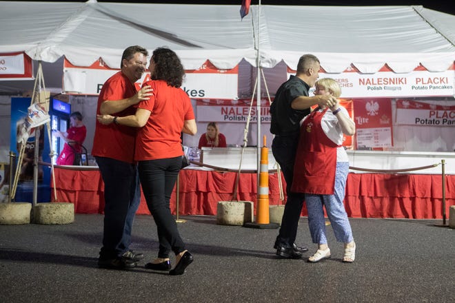 Festival goers enjoy games, food, and music at the St. Hedwig Polish Festival Tuesday, Sept. 25, 2018 in Wilmington.