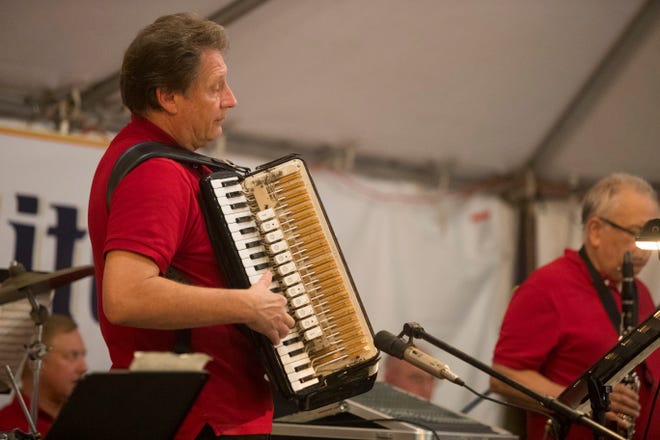 Festival goers enjoy games, food, and music at the St. Hedwig Polish Festival Tuesday, Sept. 25, 2018 in Wilmington.