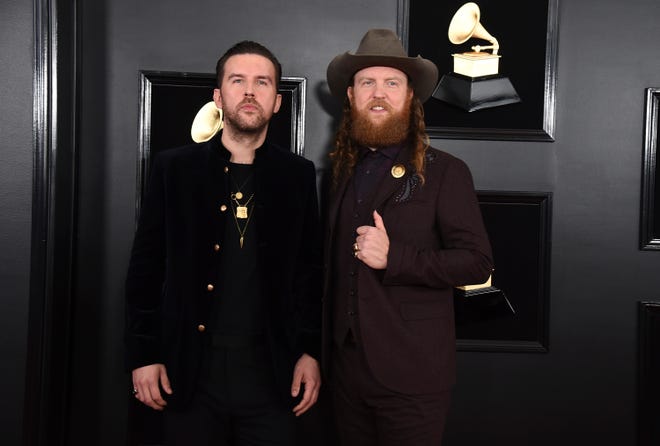 T.J. Osborne, left, and John Osborne of Brothers Osborne arrive at the 61st annual Grammy Awards at the Staples Center on Sunday, Feb. 10, 2019, in Los Angeles.