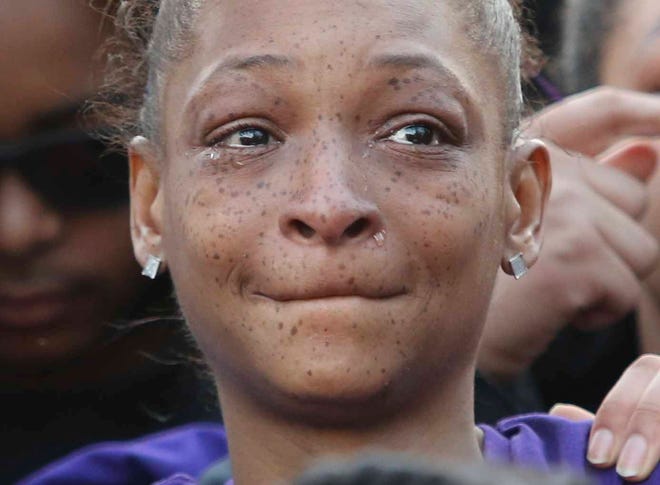Tears stream down the face of Shavontai Hale during a memorial gathering for her daughter, 17-year-old Janiya Henry, on Friday evening in Wilmington after Henry and Christian Coffield were killed earlier this week in Wilmington.