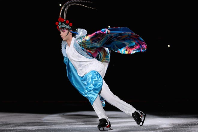 Figure skating champions Johnny Weir performs as he dresses in Peking Opera's female costume during Artistry On Ice 2014 on July 25, 2014 in Beijing, China.