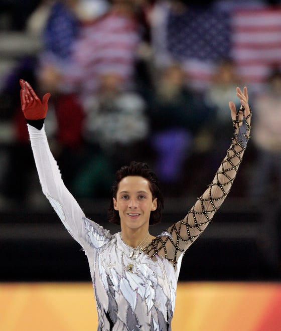 United States' Johnny Weir waves to spectators following his performance at the Men's Figure Skating short program at the Turin 2006 Winter Olympic Games in Turin, Italy, Tuesday, Feb. 14, 2006.