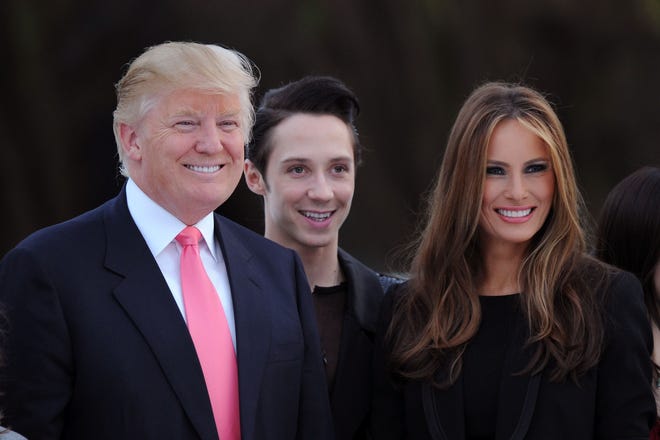 Donald Trump, figure skater Johnny Weir and Melania Trump attend the Figure Skating in Harlem's 2010 Skating with the Stars benefit gala in Central Park on April 5, 2010 in New York City.