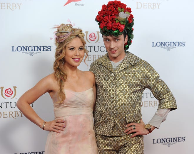 Tara Lipinski (left) and Johnny Wier arrive on the red carpet at the 2015 Kentucky Derby on Saturday, May 2, 2015 at Churchill Downs in Louisville, Ky.