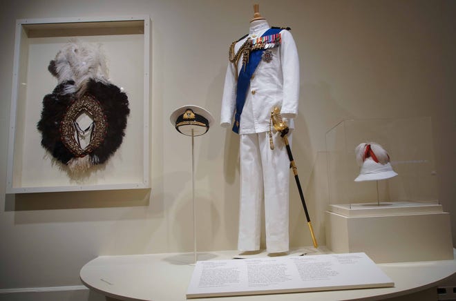 An African crown and a naval uniform worn by Matt Smith as Prince Philip in 'Costuming The Crown" at Winterthur.