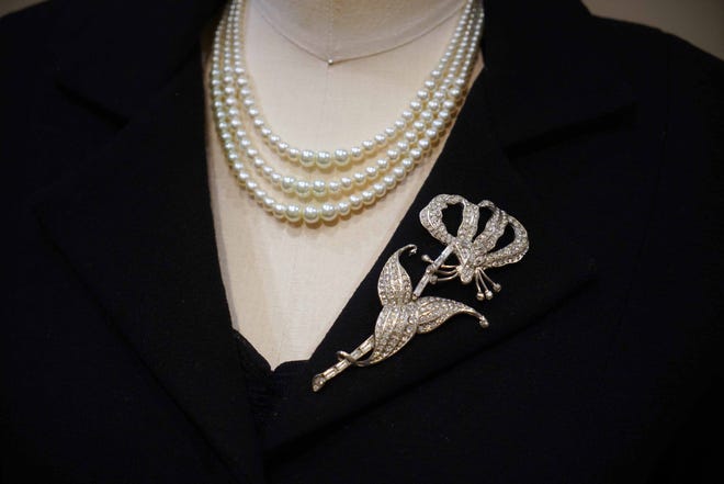 A reproduction of the mourning outfit Queen Elizabeth wore when returning from the Africa after her father's death is among the clothes on display in 'Costuming The Crown' at Winterthur Museum.