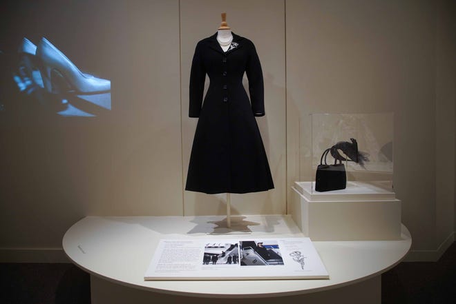 Queen Elizabeth's mourning suit is aong the 40 iconic costumes in Winterthur Museum's 'Costuming The Crown' exhibit.