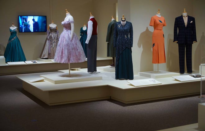 The Duke of Windsor's suit and the peach gown of the Duchess of Windsor, right, are among the 40 costumes from 'The Crown' in Winterthur Museum's 'Costuming The Crown' exhibit.