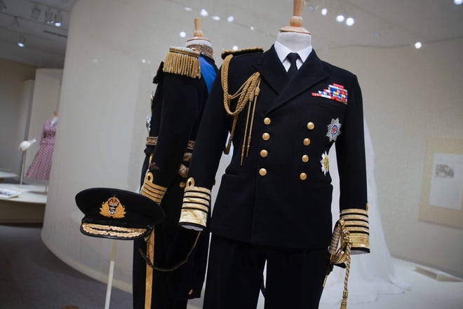 Men's military uniforms are among the clothes on display in Winterthur Museum's 'Costuming The Crown' exhibit.