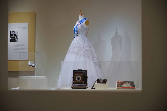This reproduction of an iconic gown worn by Queen Elizabeth that was seen on the cover of Life magazine is among the outfits in Winterthur Museum's 'Costuming The Crown' exhibit.