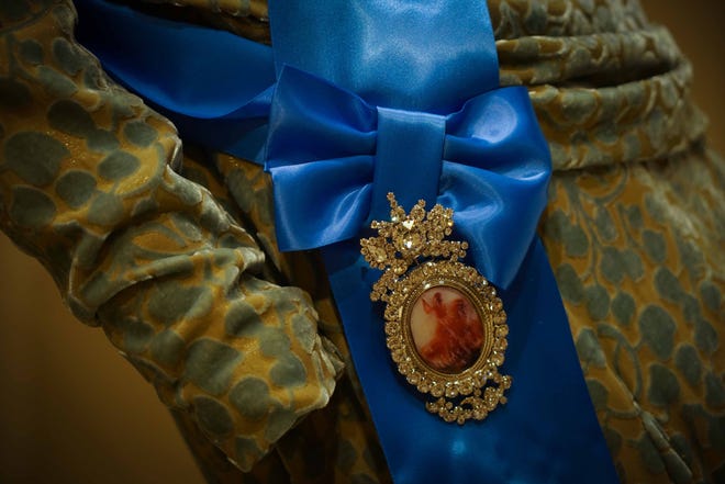 A detail of a medal worn by Queen Mary in Winterthur Museum's 'Costuming The Crown' exhibit.