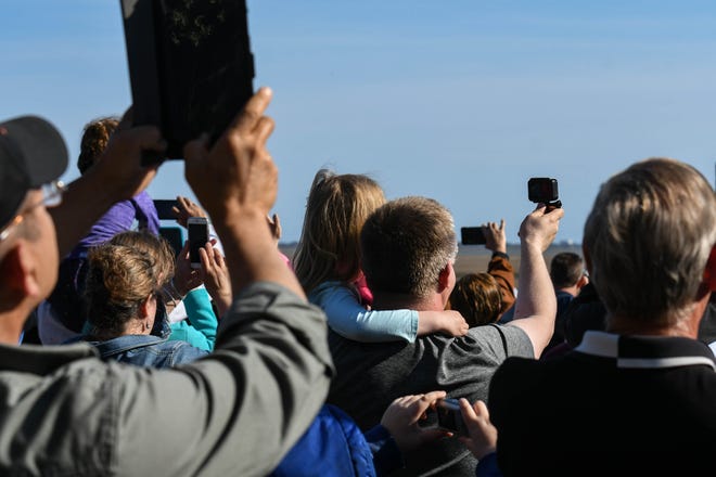 Hundreds gathered at the lawn in front of the NASA Wallops Island visitor's center to watch the NG-11 rocket launch on Wednesday, April 17, 2019.