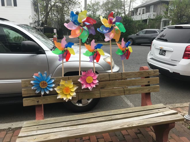 Colorful pinwheels decorate this bench on Baltimore Avenue in Rehoboth Beach.