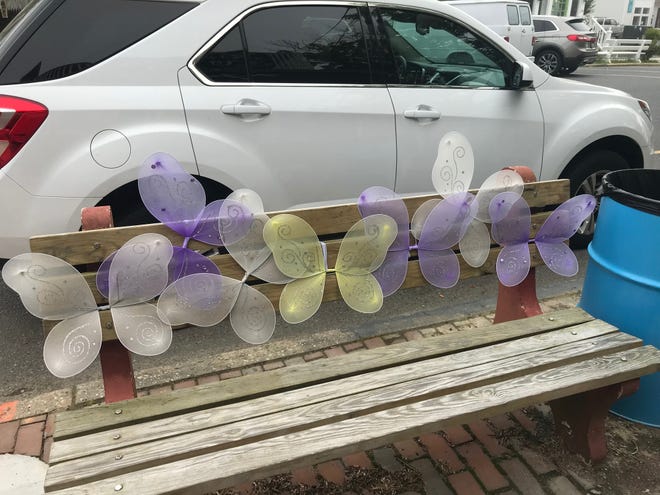 Butterflies grace the back of this wooden bench on Rehoboth's Baltimore Avenue.